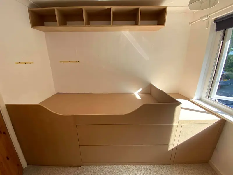 Small custom built cabin bed with underbed storage