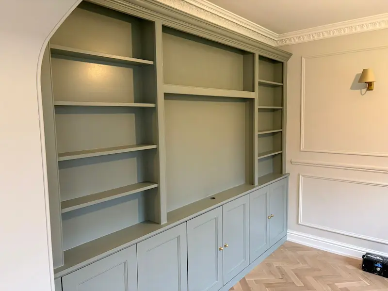 Media wall in alcove behind archway