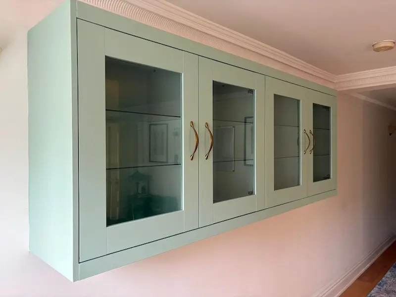 Dining room cabinetry finished with farrow and ball whirly bird