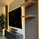 Illuminated feature tv wall with acoustic panelling in tunbridge wells